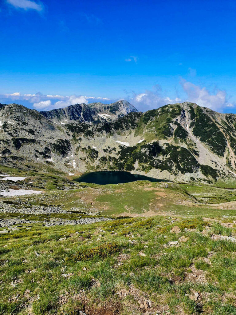 One of Vlahini Lakes in the distance as seen from Kabata Saddle in Pirin Mountains