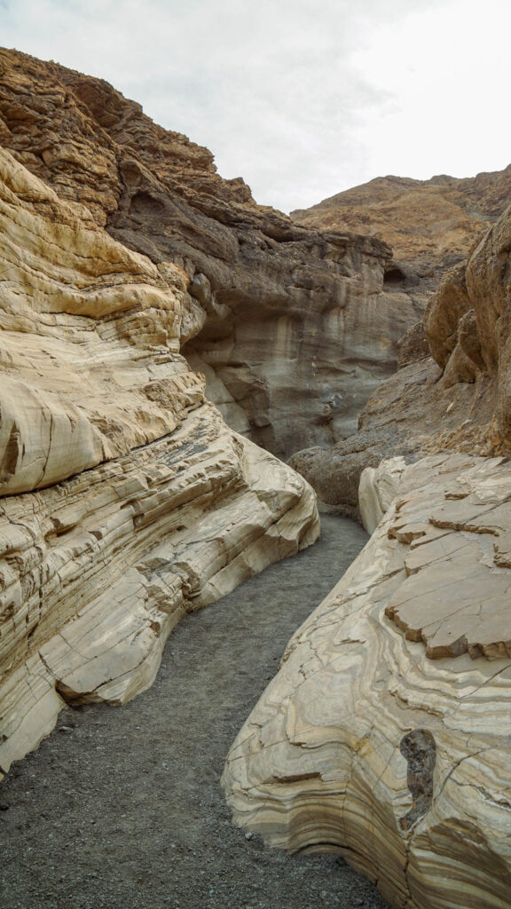 The smooth marble rocks surrounding the trail at the first section of the Mosaic Canyon Trail in Death Valley National Park