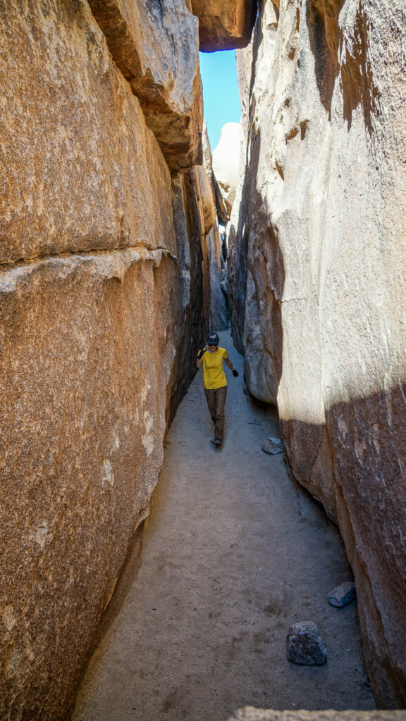 Me jumping around inside the tunnel at the Hall of Horrors in Joshua Tree