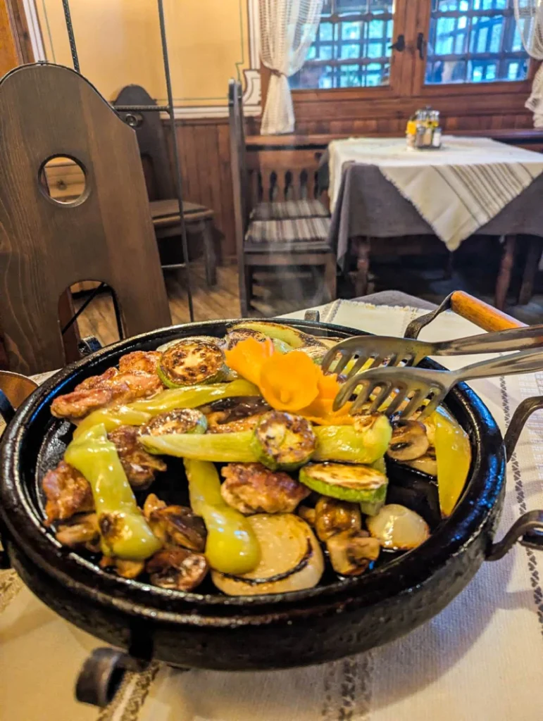 Delicious "sach" with meat and vegetables at one of the places to eat in Koprivshtitsa