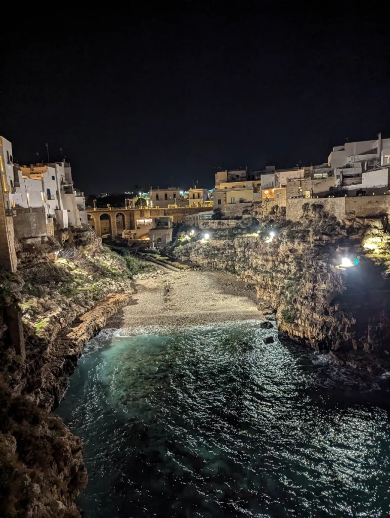 Night views of Lama Monachile Beach - one of the best places to visit in Polignano a Mare