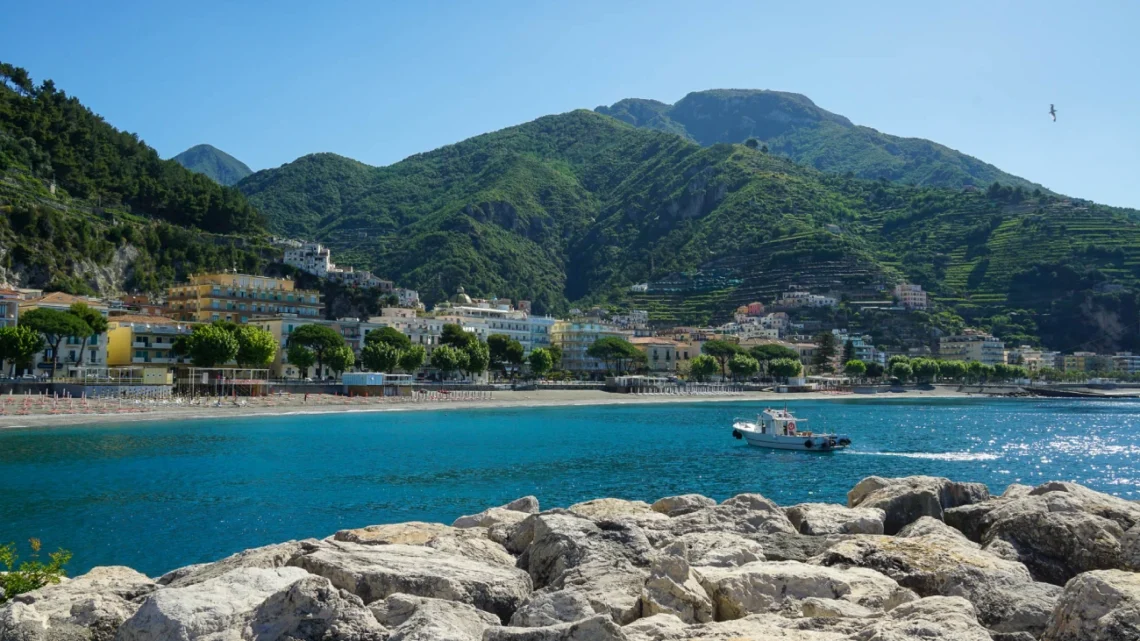 Maiori on the Amalfi Coast - the blue water, the city and the lush green hills surrounding it in the background