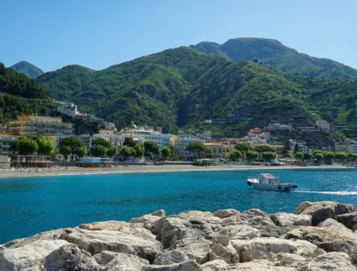 Maiori on the Amalfi Coast - the blue water, the city and the lush green hills surrounding it in the background