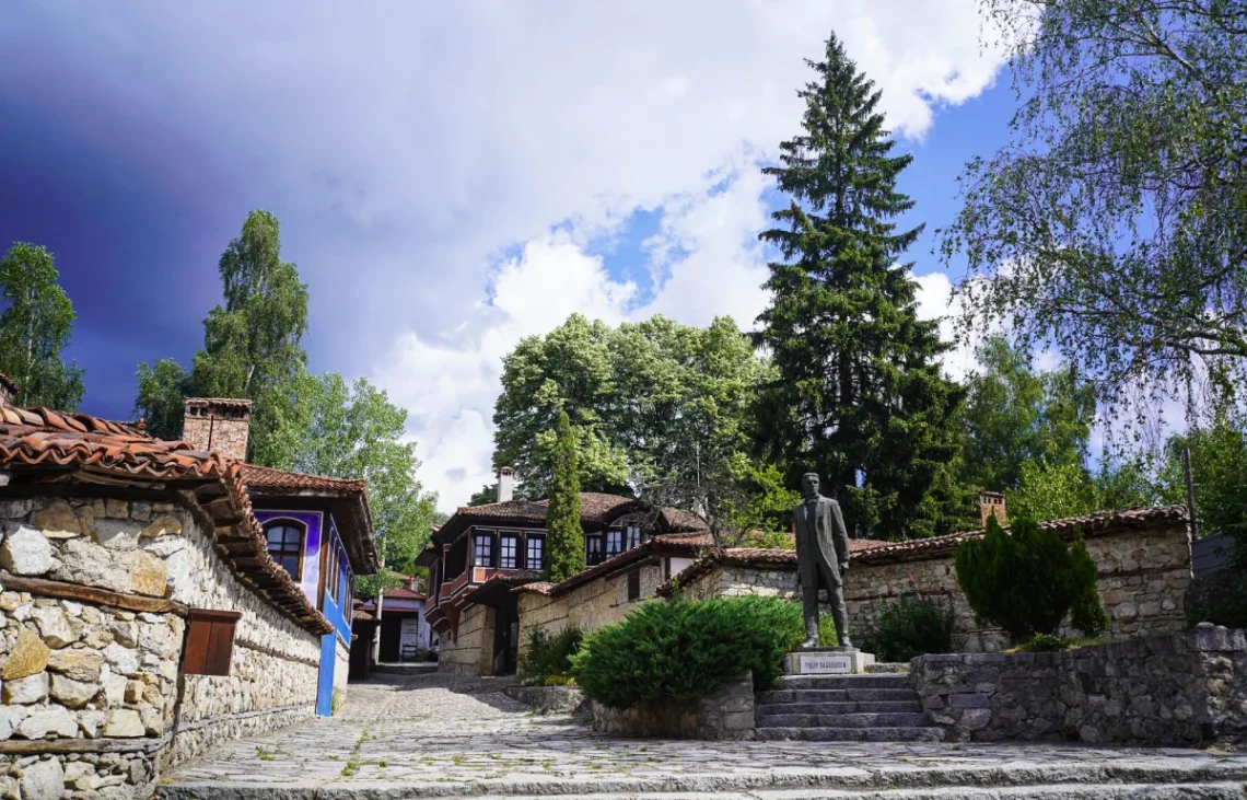 Visit Koprivshtitsa - view of the beautiful cobblestone streets and Todor Kableshkov Monument
